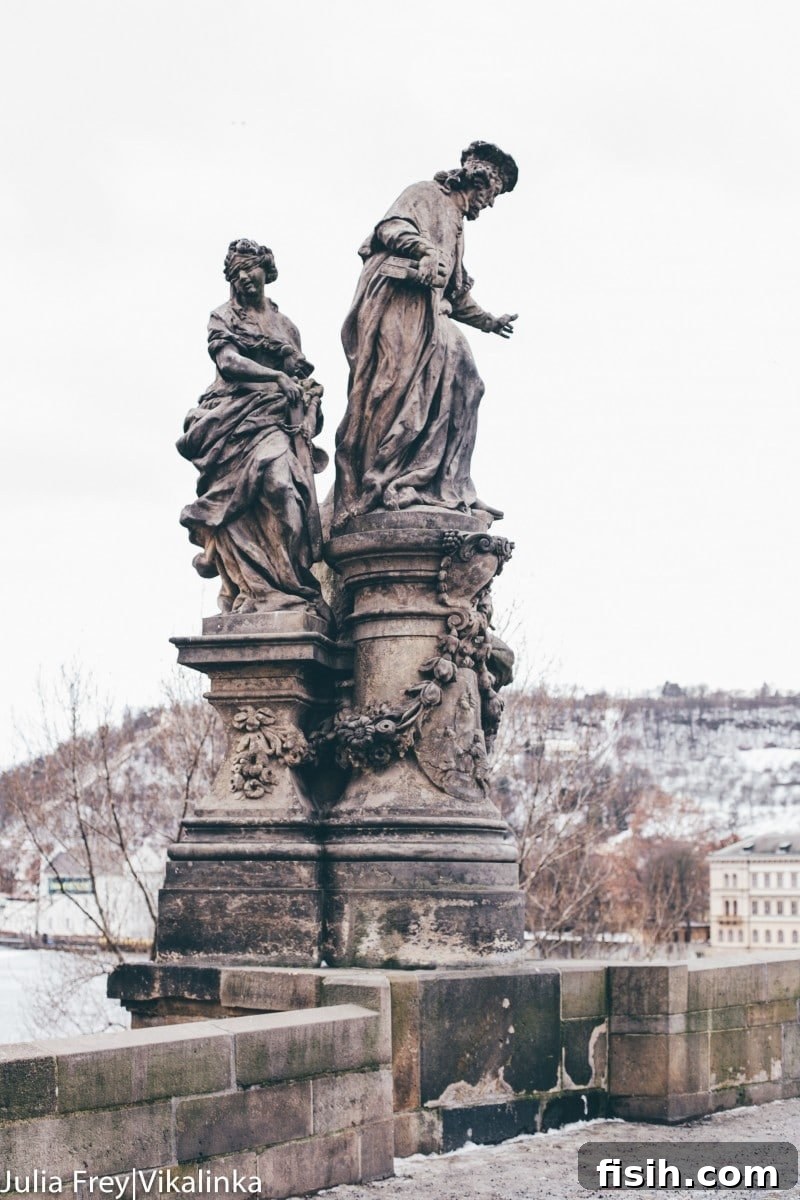 Charles Bridge with Baroque statues and Prague Castle in background