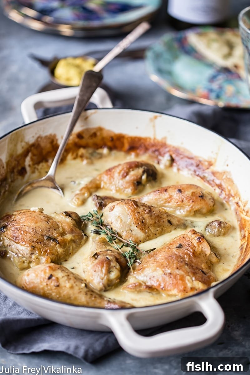 Creamy Wine Mustard Chicken 8 A delectable view of Chicken in Wine and Mustard Sauce, ready to be served, highlighting its rich texture and inviting aroma.