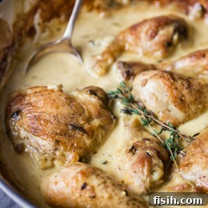 Creamy Wine Mustard Chicken 9 chicken in mustard cream sauce in white pan