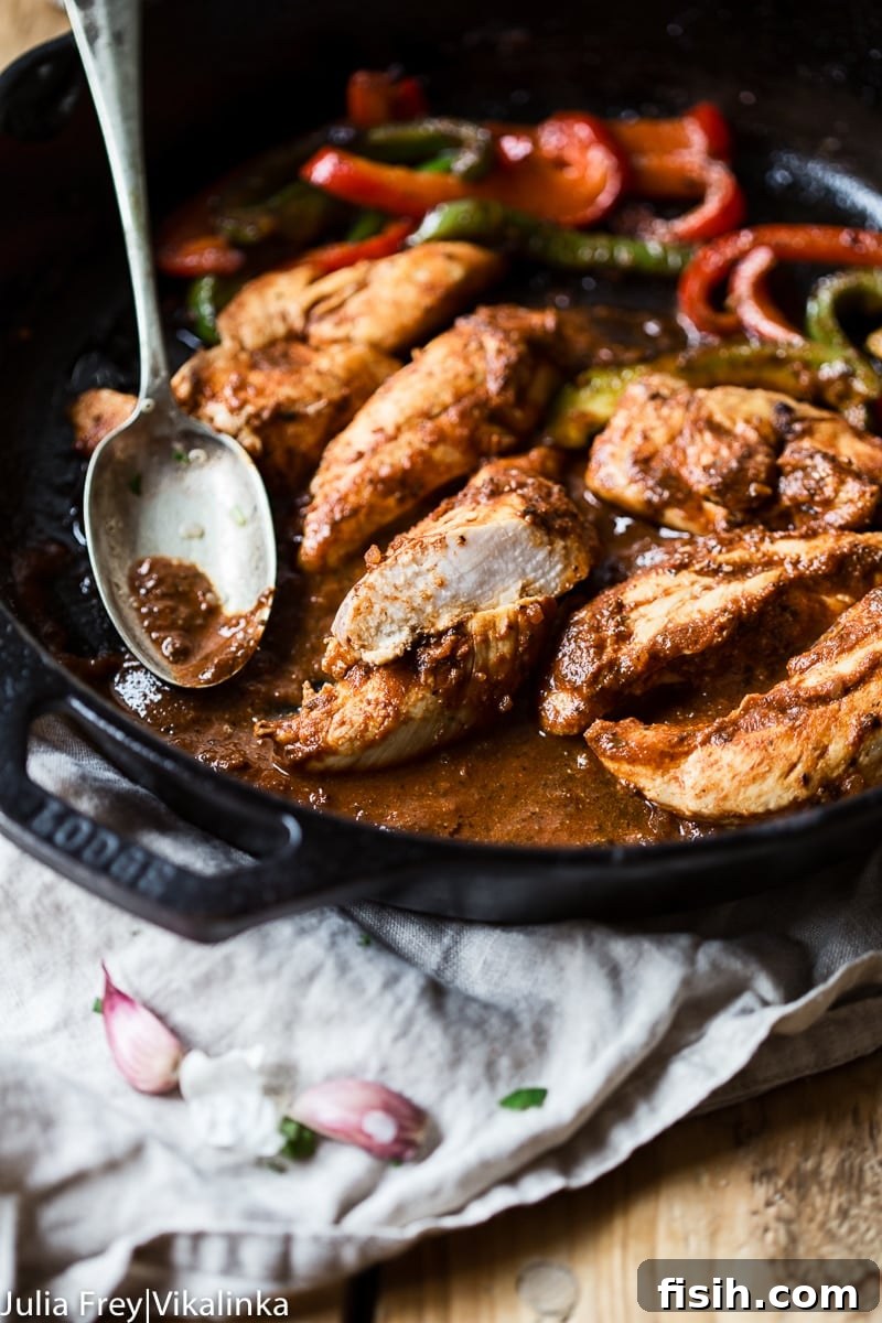 Fiesta Chicken Fajita Bowl 3 Cast iron pan with chicken and peppers