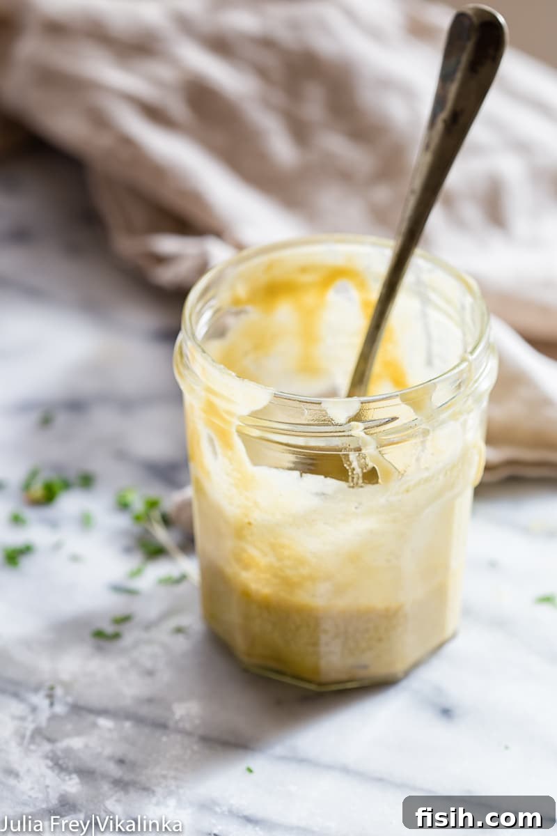 Close-up of a jar filled with fresh tahini dressing