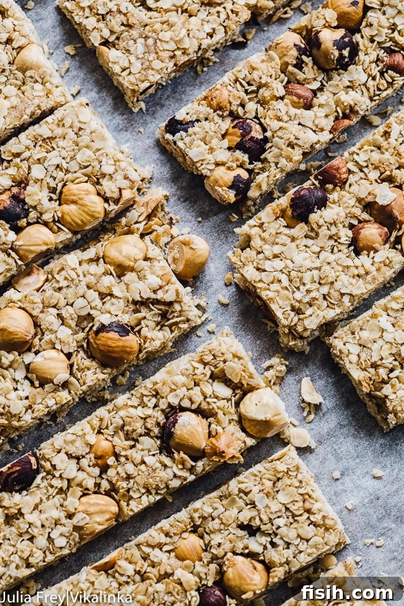 Close-up view of perfectly cut granola bar squares, showcasing their texture and ingredients.