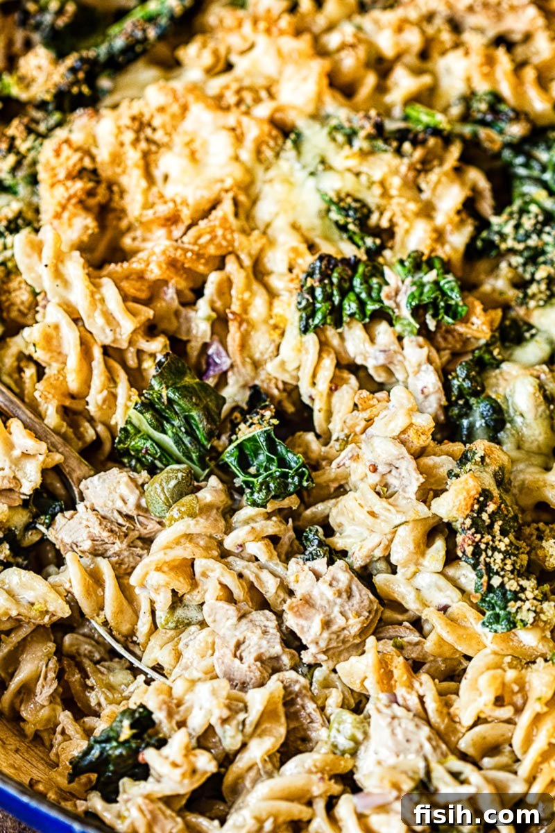 Freshly baked tuna noodle casserole with kale, golden brown topping