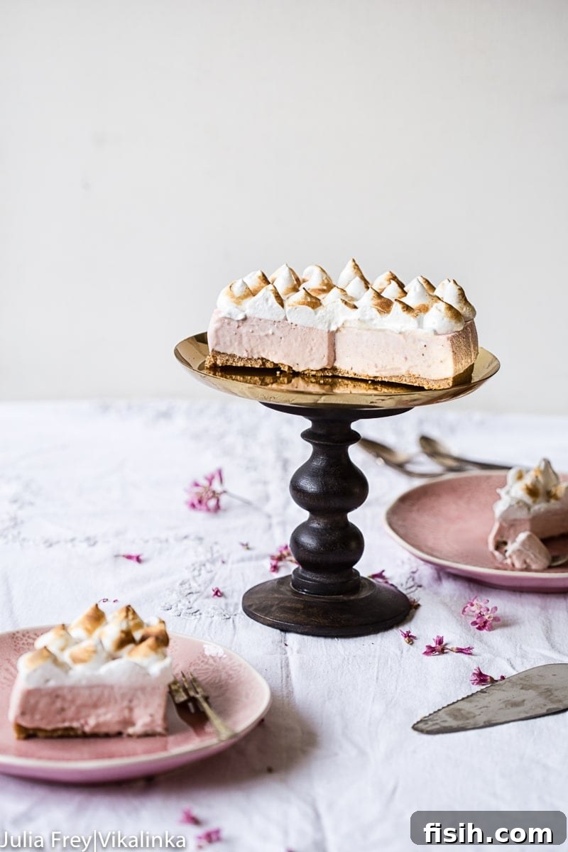 Cheesecake on a cake stand with pieces removed and plated
