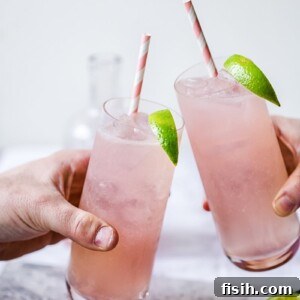 Two glasses of Rhubarb Moscow Mule brought together in toast