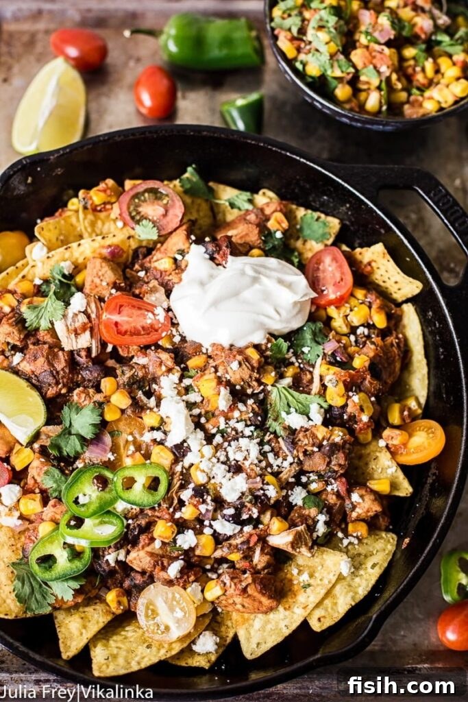 Chicken Chilaquiles with Warm Sweet Corn Salsa 2 Chicken chilaquiles with warm corn salsa in a cast iron pan from the top down