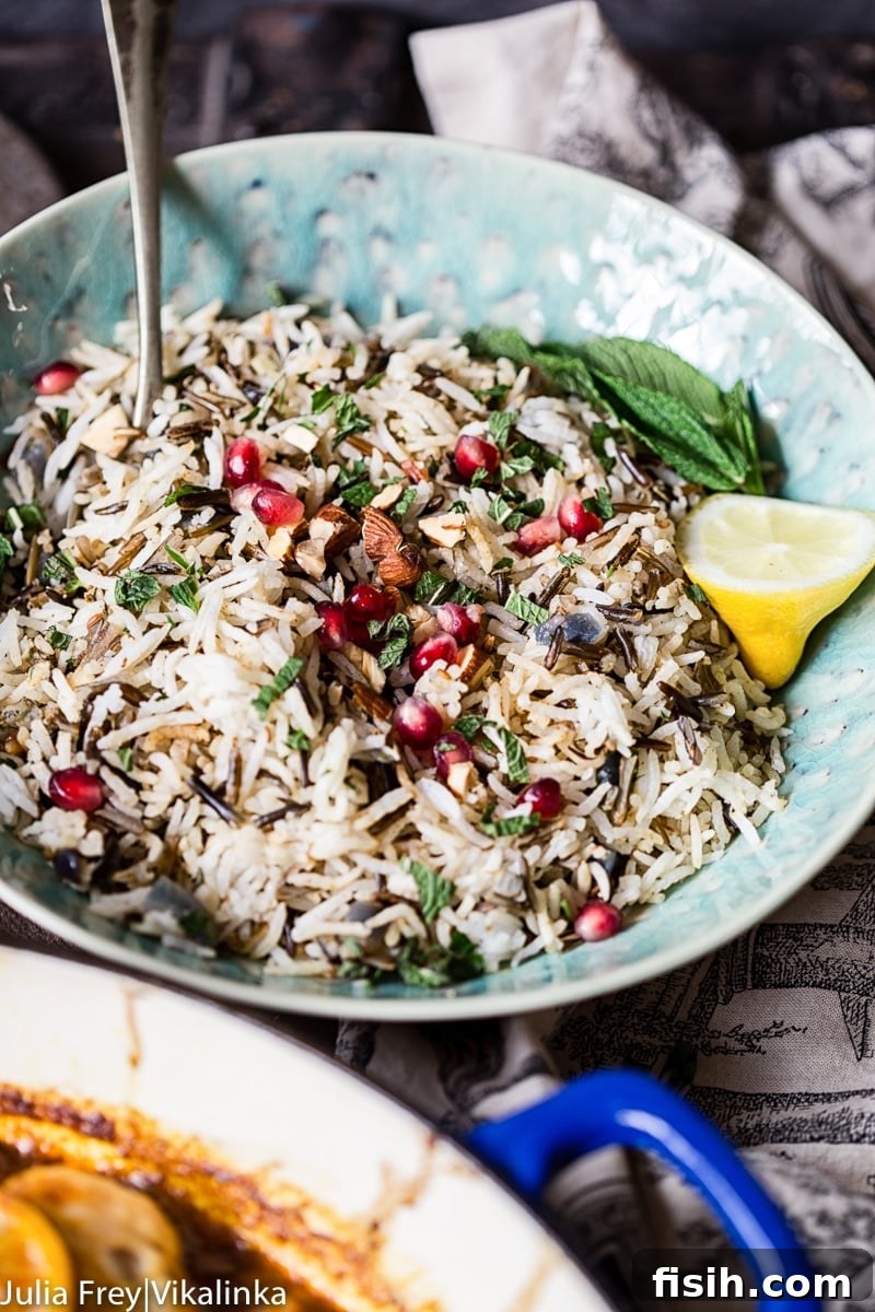 Fragrant Moroccan Chicken Tagine 5 bowl of cooked and spiced rice with pomegranate seeds