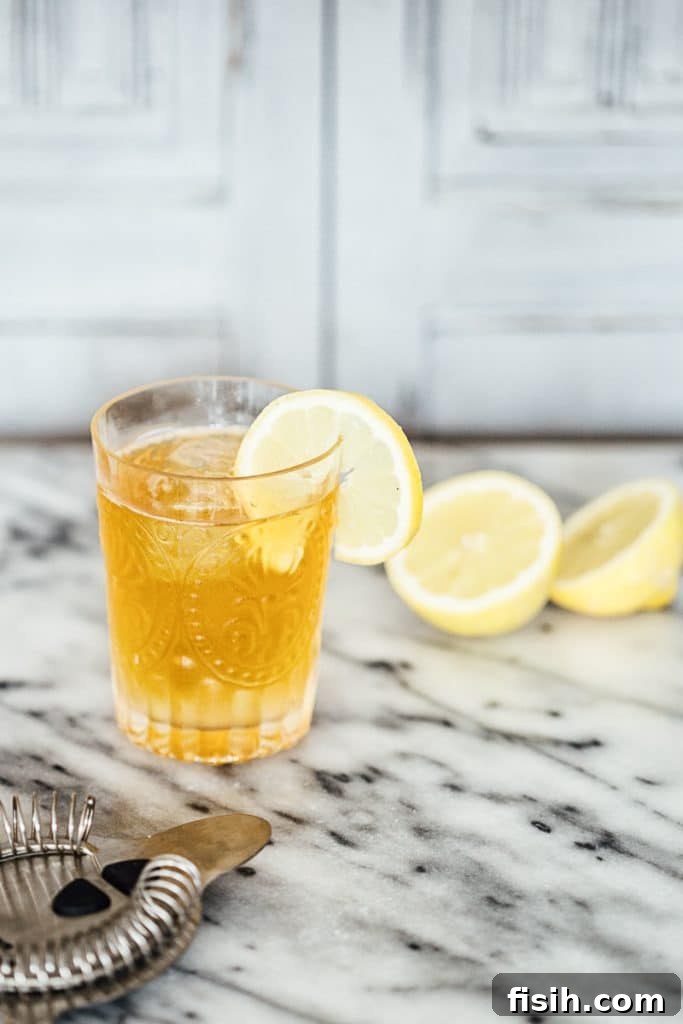 Elevate Your Gin and Tonic Three Ways 3 Close up of Earl Grey Gin and tonic in a glass with a lemon slice