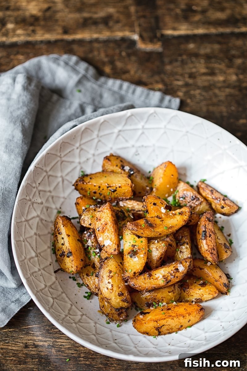Chipotle Mayo Roasted Potato Wedges presented beautifully in a rustic bowl, ready to be served.