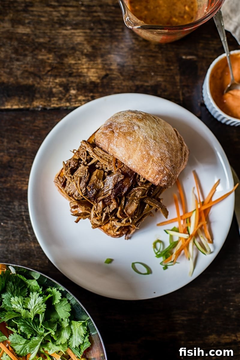 Fusion Pulled Pork Sandwiches with Zesty Root Vegetable Slaw 3 Pulled pork sandwich before slaw is added