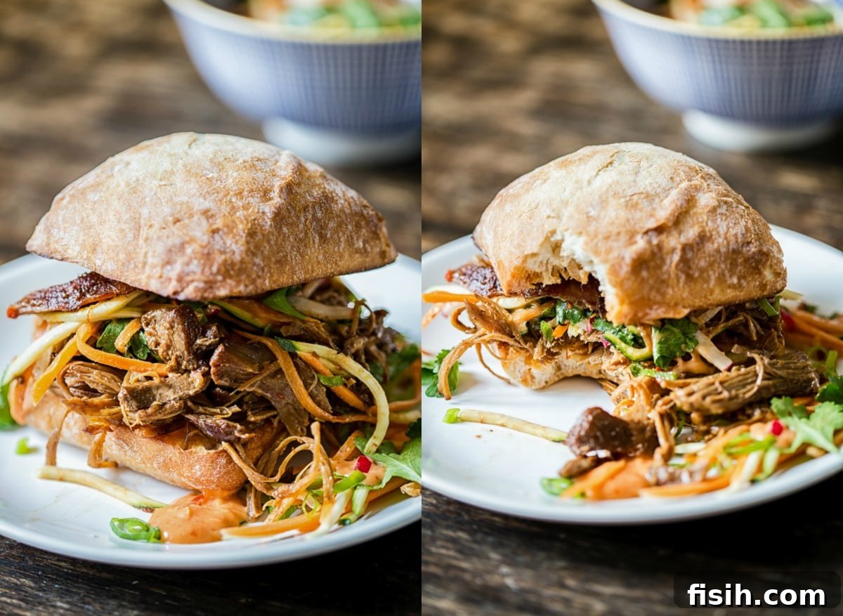 Fusion Pulled Pork Sandwiches with Zesty Root Vegetable Slaw 7 two buns with the filling on a plate
