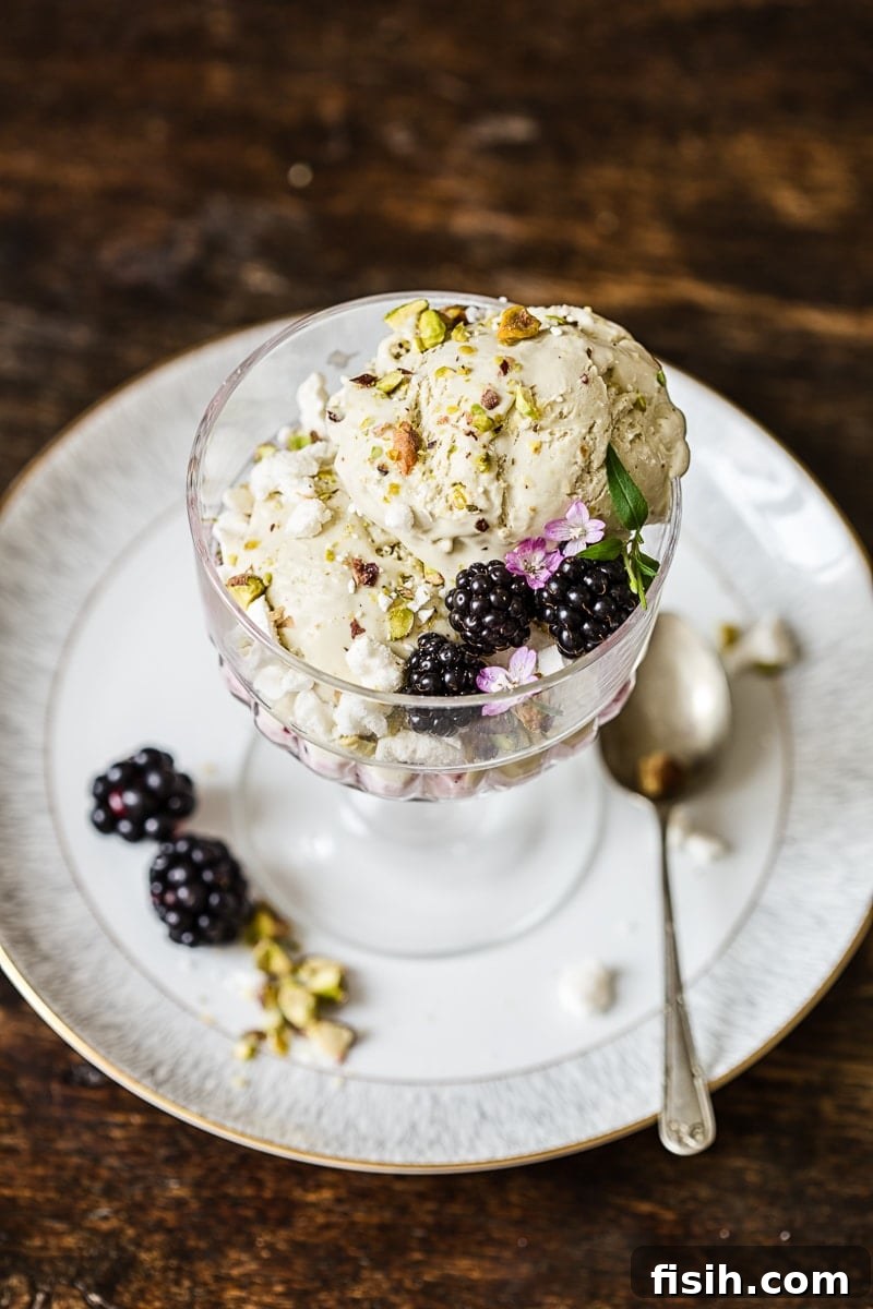 Dish of the Eton mess on a saucer with a spoon