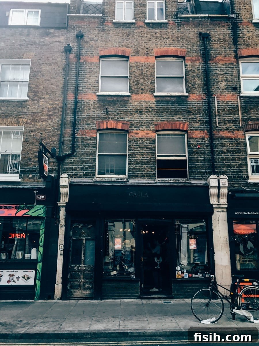 Explore Shoreditch's Vibrant Street Art 14 Historic building facade in Shoreditch with modern elements, reflecting the area's character