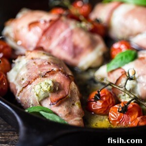 Side view of chicken parcels with cherry tomatoes