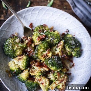 roasted broccoli with sun-dried tomatoes in grey bowl