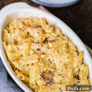Smoky Bacon Brie Macaroni Bake 7 Top down of brie and bacon mac and cheese in a rustic baking dish.