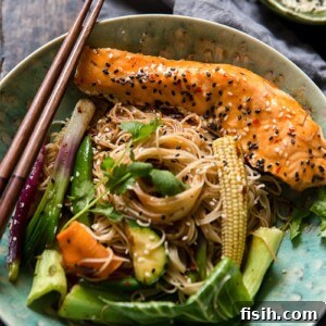 Bowl of fried noodles with vegetables and fish