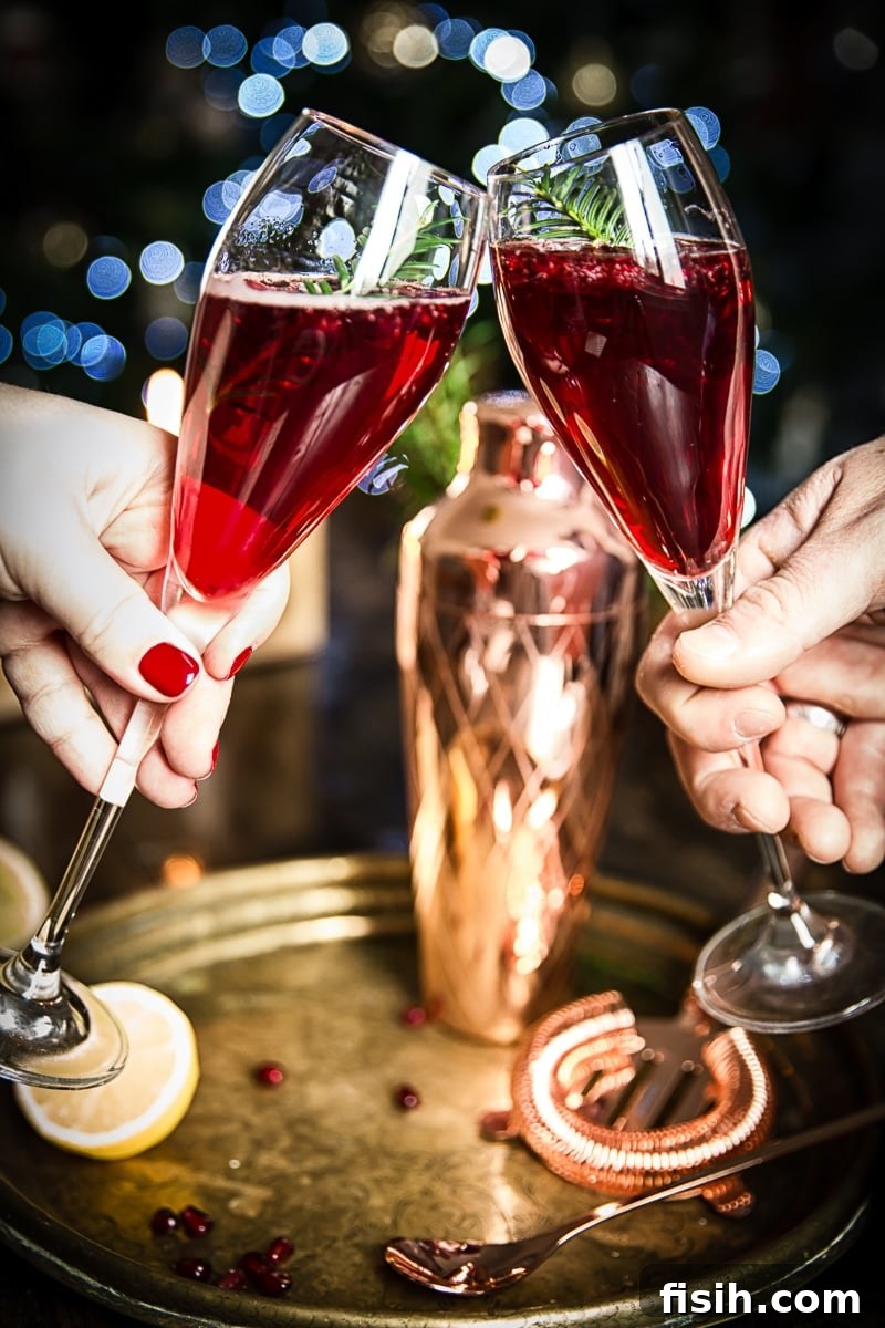 Two champagne glasses clinking together in a festive toast, celebrating the holiday season
