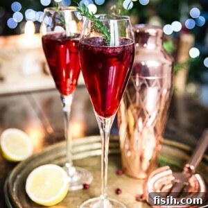 Two glasses of Pomegranate French 75 on a platter