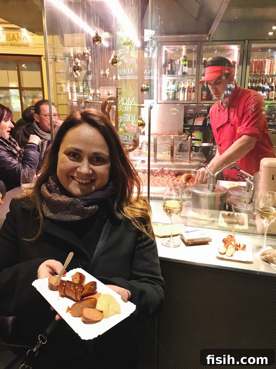 Julia enjoying a sausage at Bitzinger Würstelstand in Vienna