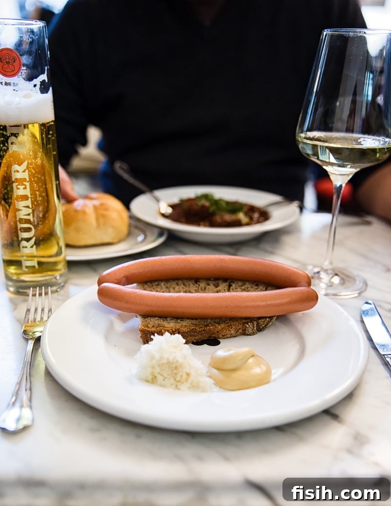 Cafe lunch with traditional Austrian sausage, wine, and beer