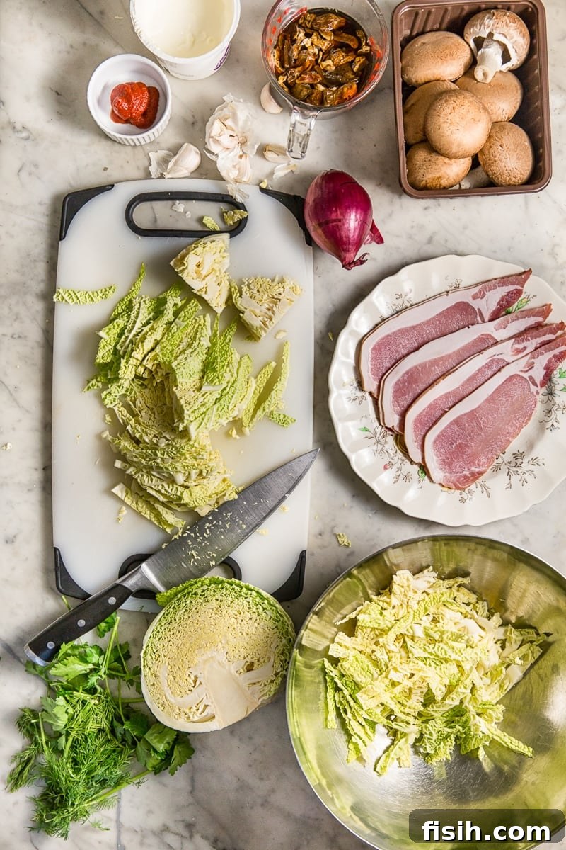 Smoky Bacon & Mushroom Savoy Braise 3 Top down shot showing ingredients for braised cabbage on a table