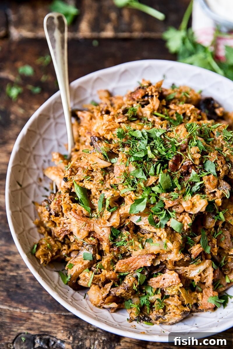 Smoky Bacon & Mushroom Savoy Braise 6 Bowl of cabbage with a spoon
