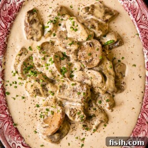Close up of a plate with beef in creamy sauce
