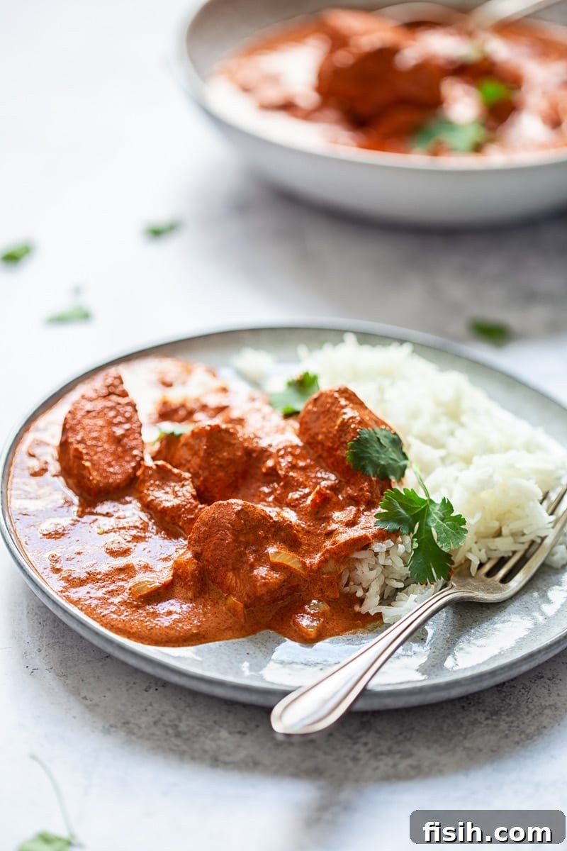 Signature Takeaway Butter Chicken 3 Butter Chicken Curry on a plate with fork