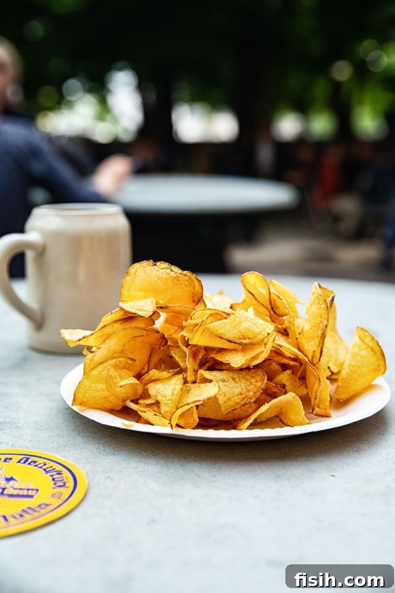 Crispy potato chips and a refreshing glass of beer from Augustiner Bräu, a perfect pairing