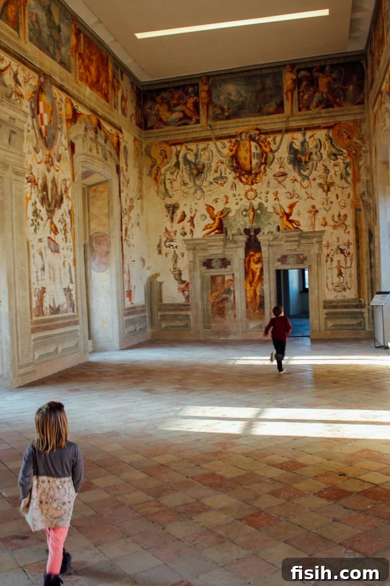 Child sketching in a notepad in front of a historic building during travel