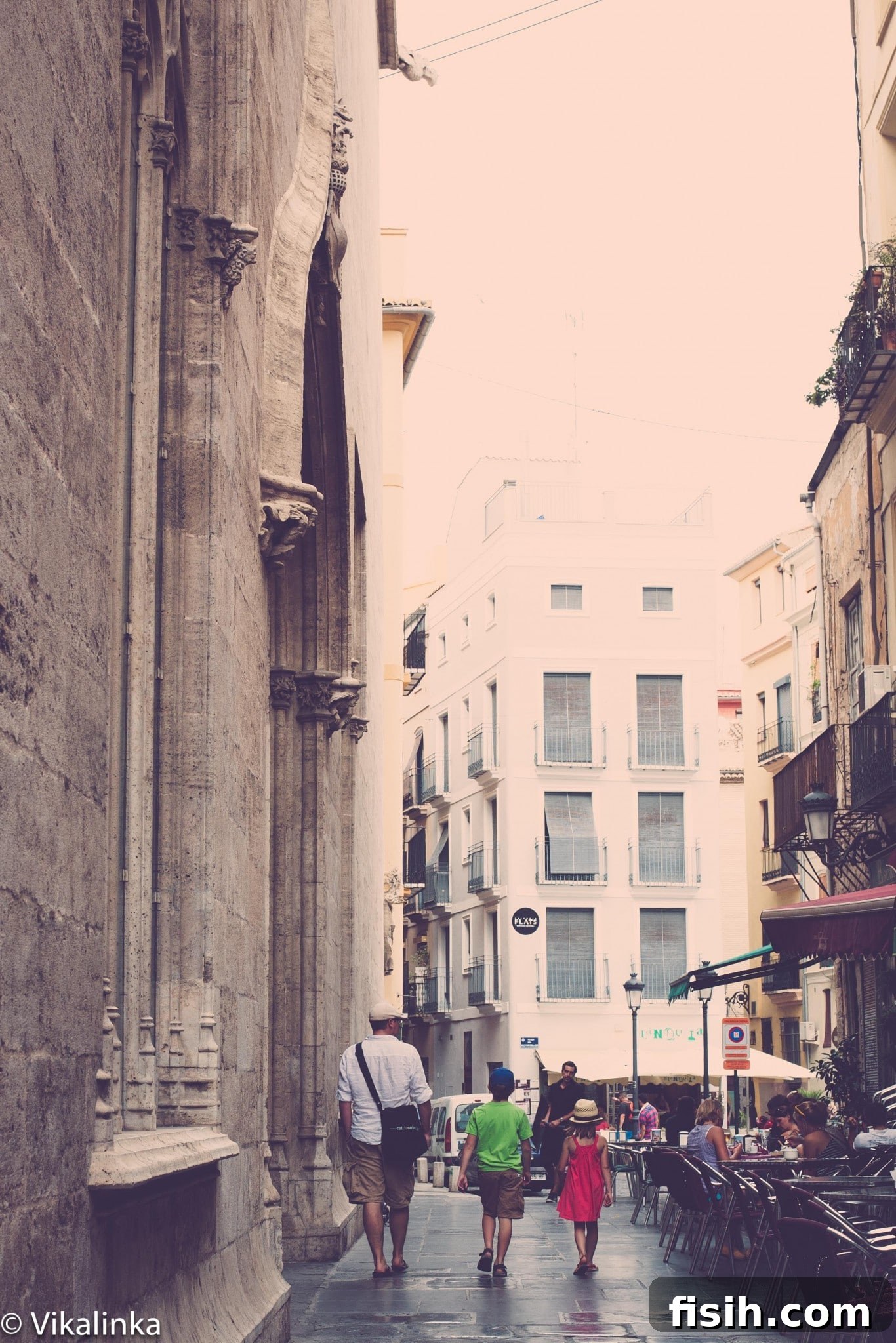 Mother and child exploring a city street while traveling