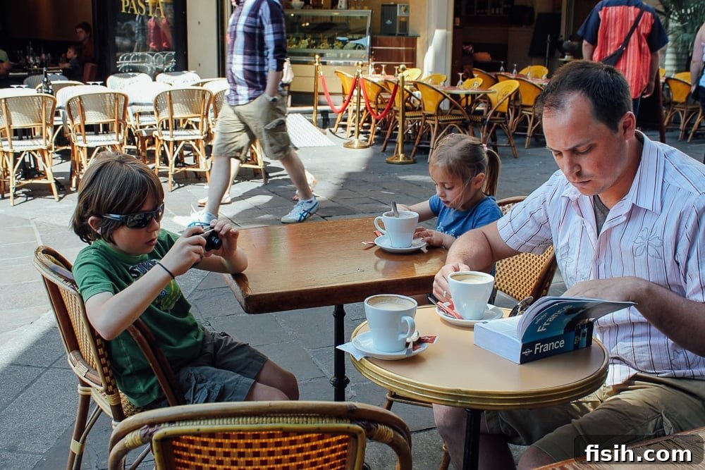 Family enjoying a meal together at an outdoor restaurant