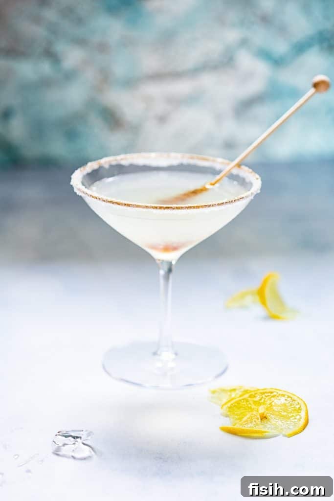 Side shot of stir stick dipped in Lemon Drop Martini