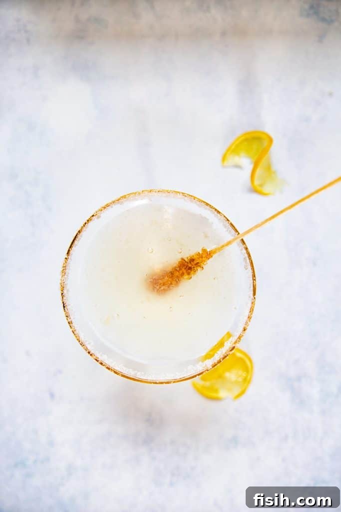 Top down view of stir stick in Lemon drop martini