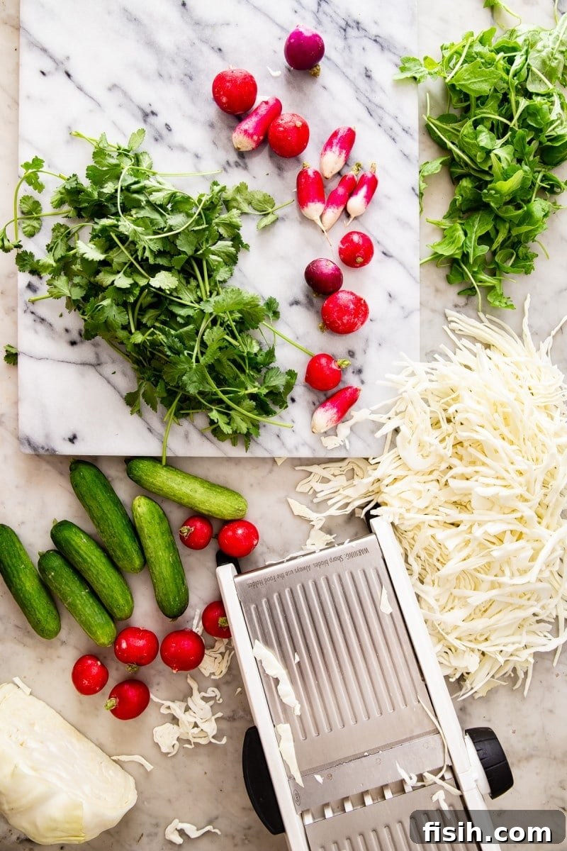 Creamy Keto Cabbage Slaw 4 Top-down view of ingredients including shredded cabbage on a cutting board