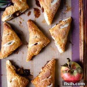 Golden Apple Pockets 9 Apple Turnovers on a baking sheet
