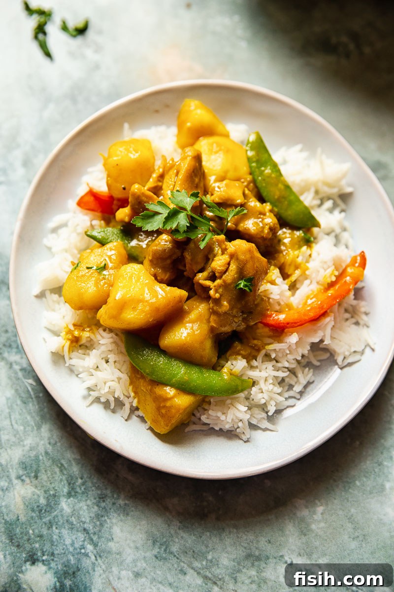 Golden Goodness Homemade Chinese Chicken Curry 3 Chinese chicken curry served over fluffy basmati rice, ready to eat