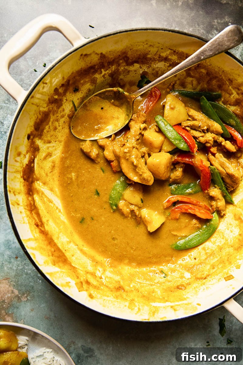 Golden Goodness Homemade Chinese Chicken Curry 6 Close-up of a bowl of Chinese Chicken Curry, perfectly garnished