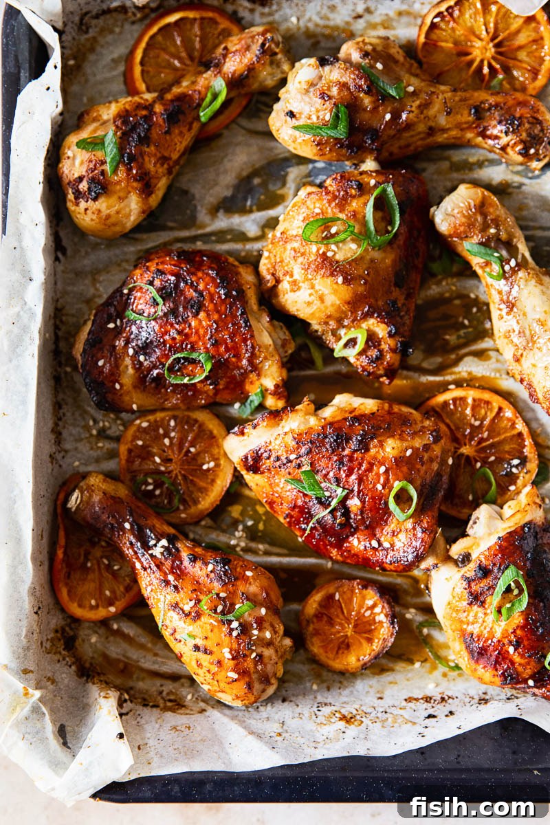Sweet and Sticky Oven-Baked Chicken Thighs and Drumsticks 2 Honey Soy Chicken Thighs and Legs in roasting pan, ready to be baked
