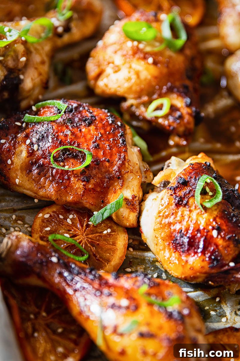 Sweet and Sticky Oven-Baked Chicken Thighs and Drumsticks 5 Honey Soy Chicken Thighs and Legs in roasting pan after basting