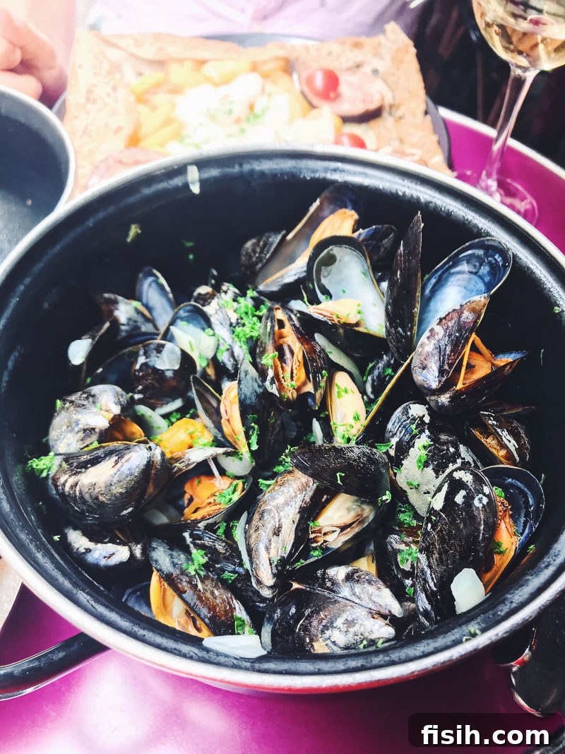Close-up of a delicious lunch of mussels with fries