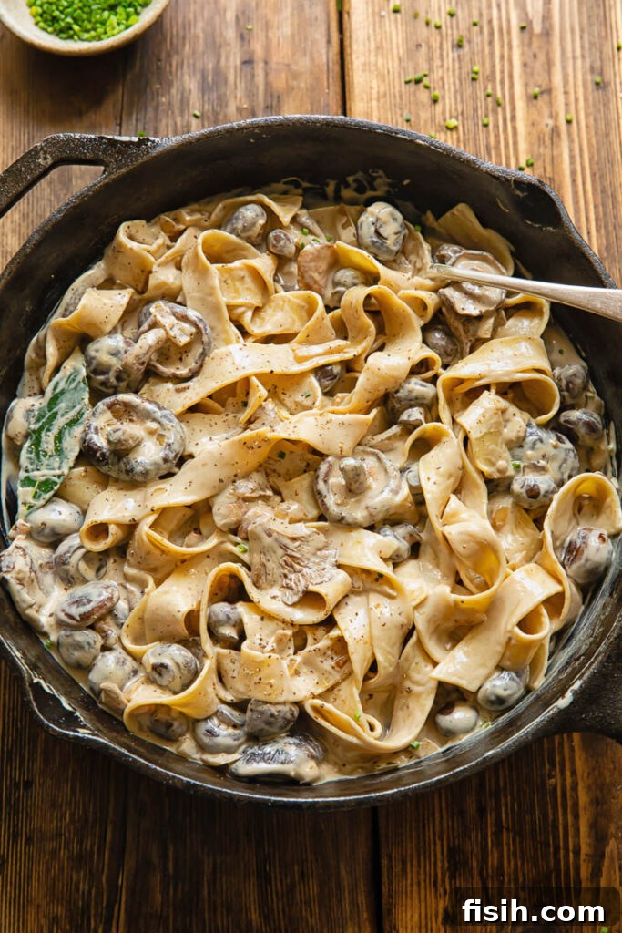 top down of a pan of mushroom stroganoff with thick pasta