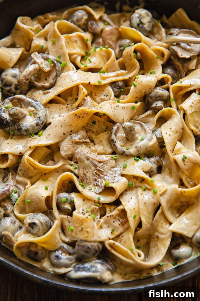 close up of a pan of mushrooms and pasta
