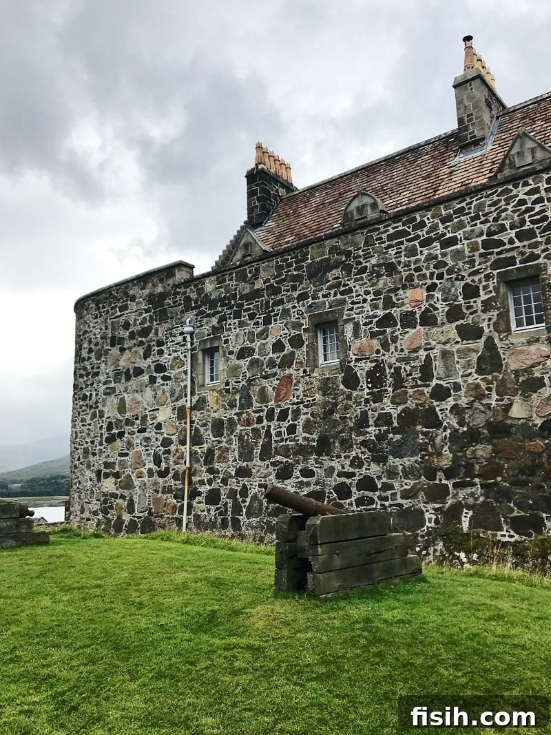 Unveiling Mull's Island Magic 10 Majestic Duart Castle standing proudly on a rocky headland overlooking the sea, under a blue sky.