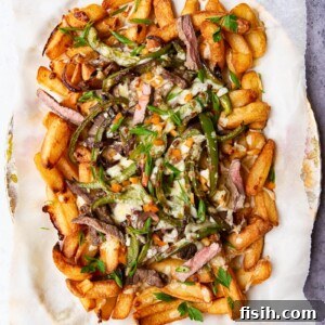 Smothered Philly Cheesesteak Fries 6 Fries loaded with steak, green peppers and melted cheese.