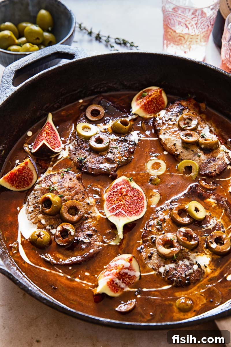 sweet and sour pork chops in sauce with olives and figs