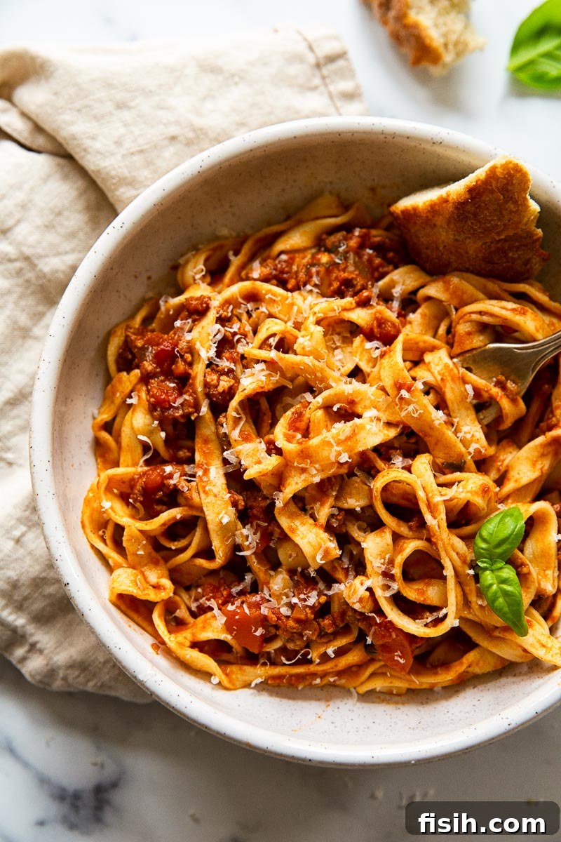 Perfect Fresh Pasta from Scratch 7 Homemade tagliatelle served with a rich bolognese sauce