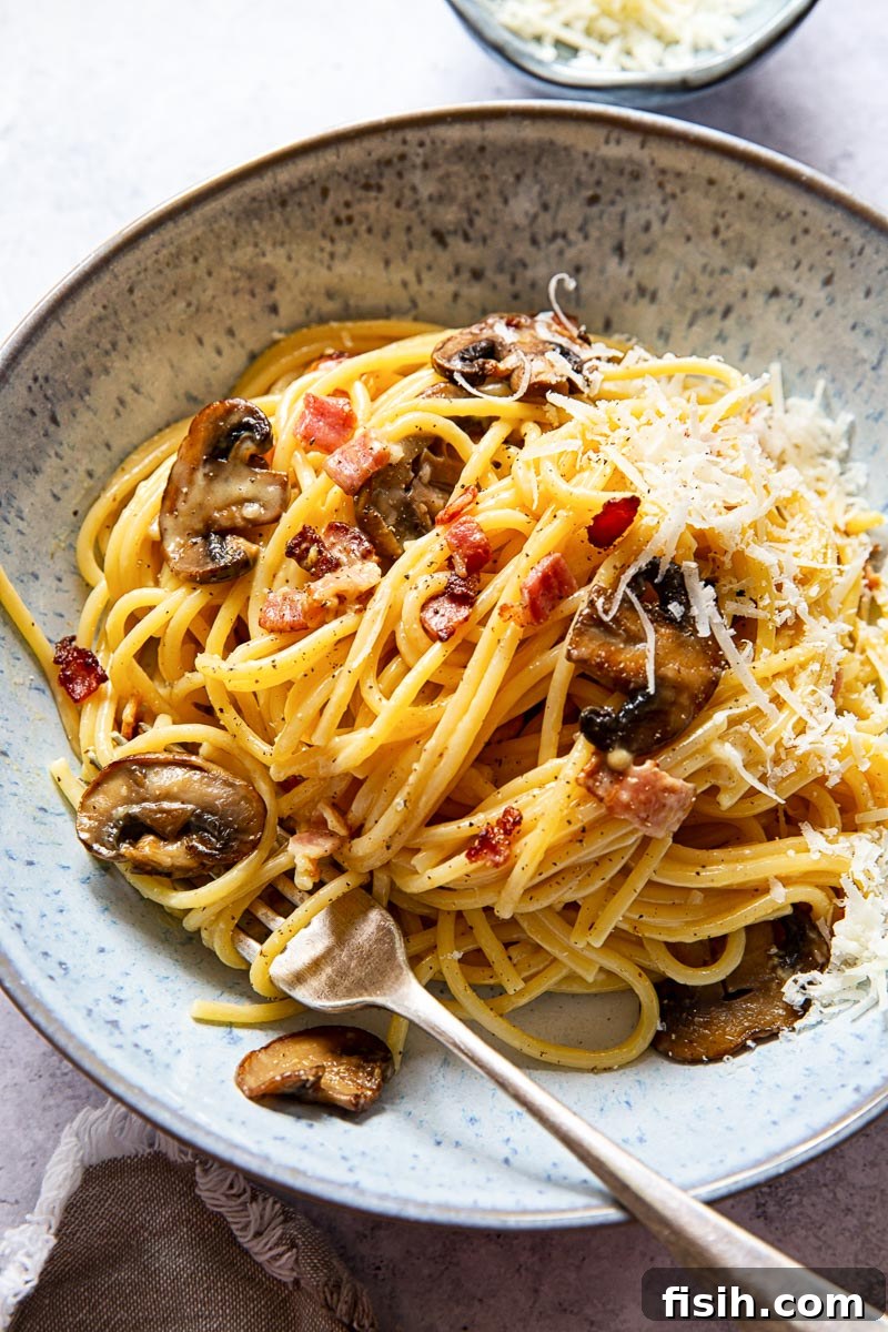 Lightning-Fast Mushroom Carbonara 5 Mushroom Carbonara in blue bowl