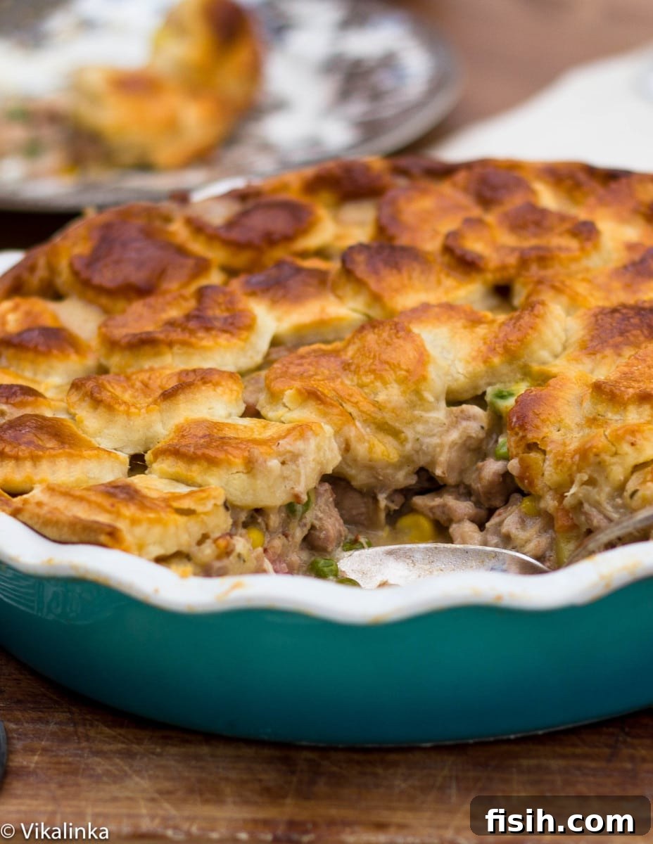 Hearty Wild Rabbit and Pheasant Pie in a blue ceramic dish, served warm